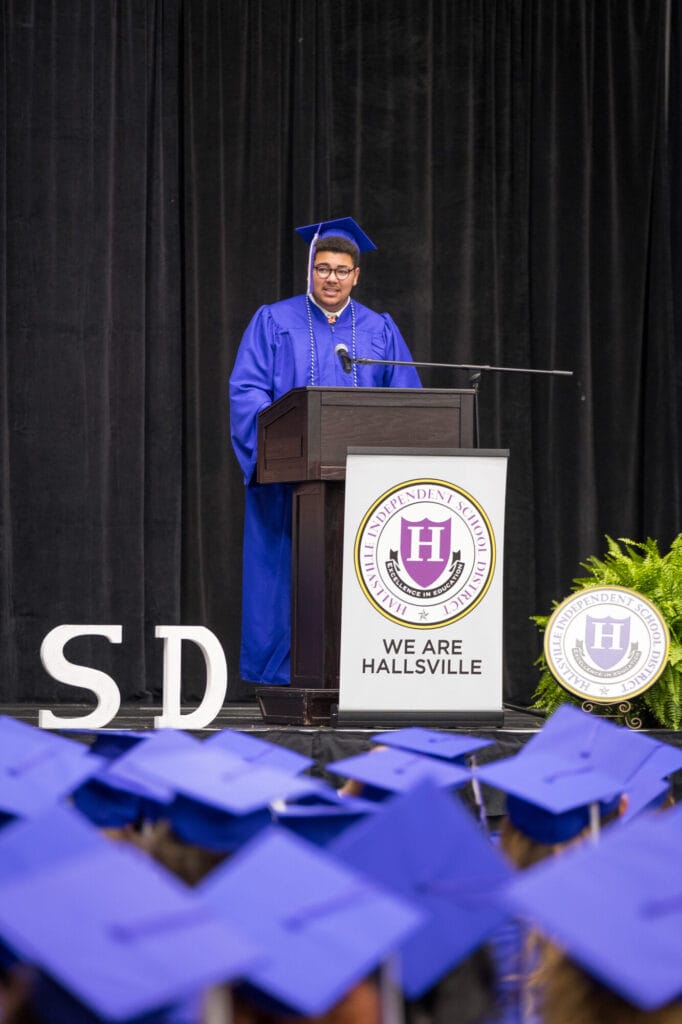 TVAH student speaker at podium during graduation ceremony.