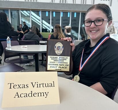 A child holding a plaque