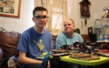 A child and person sitting in a room