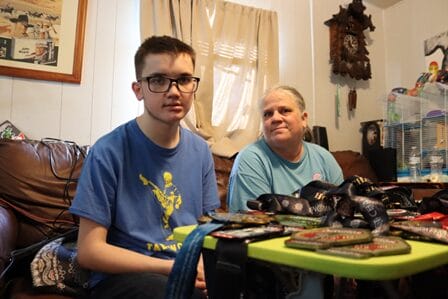 A child and person sitting in a room
