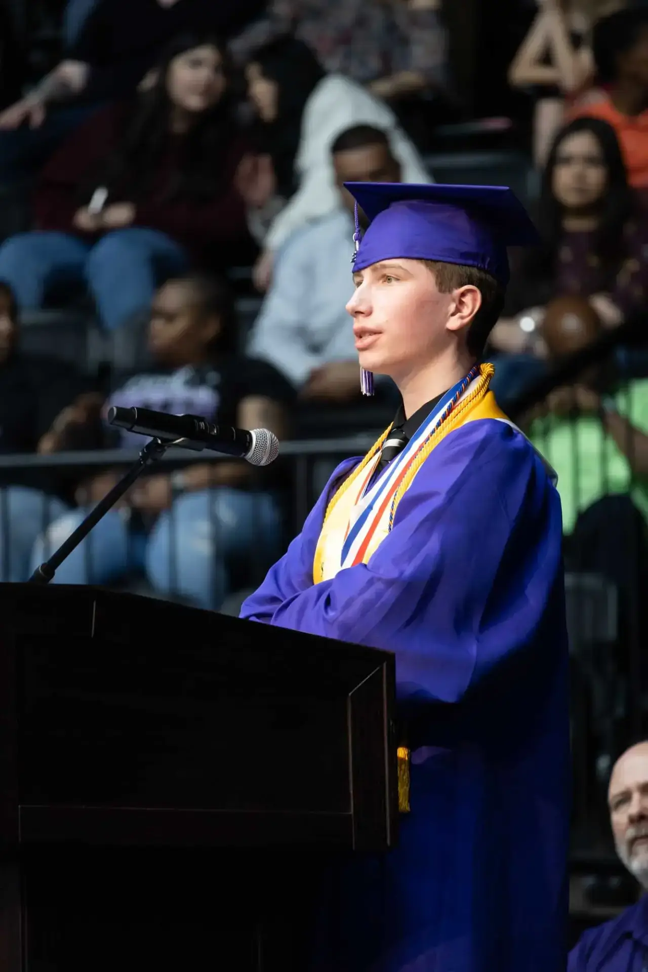 student speaking at graduation