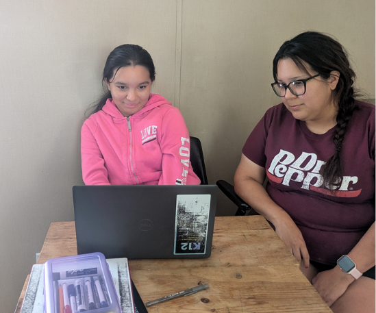 student studying with parent
