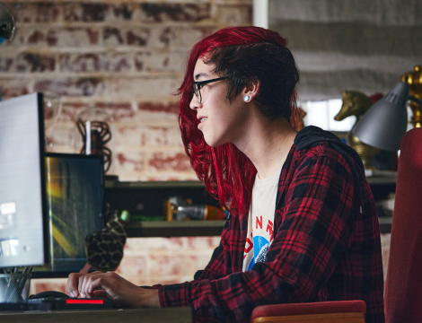 Student working with his computer at home